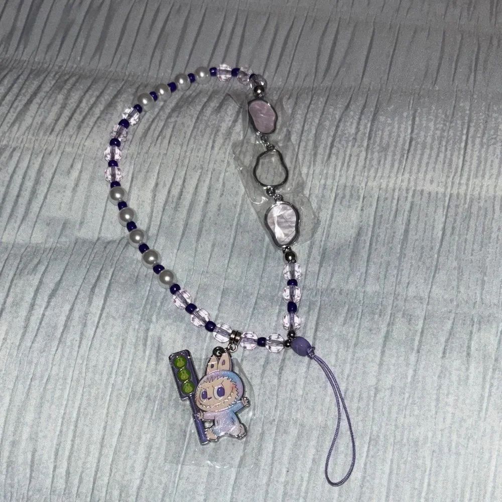 BIG INTO ENERGY PHONE CHARM ( LUCK )